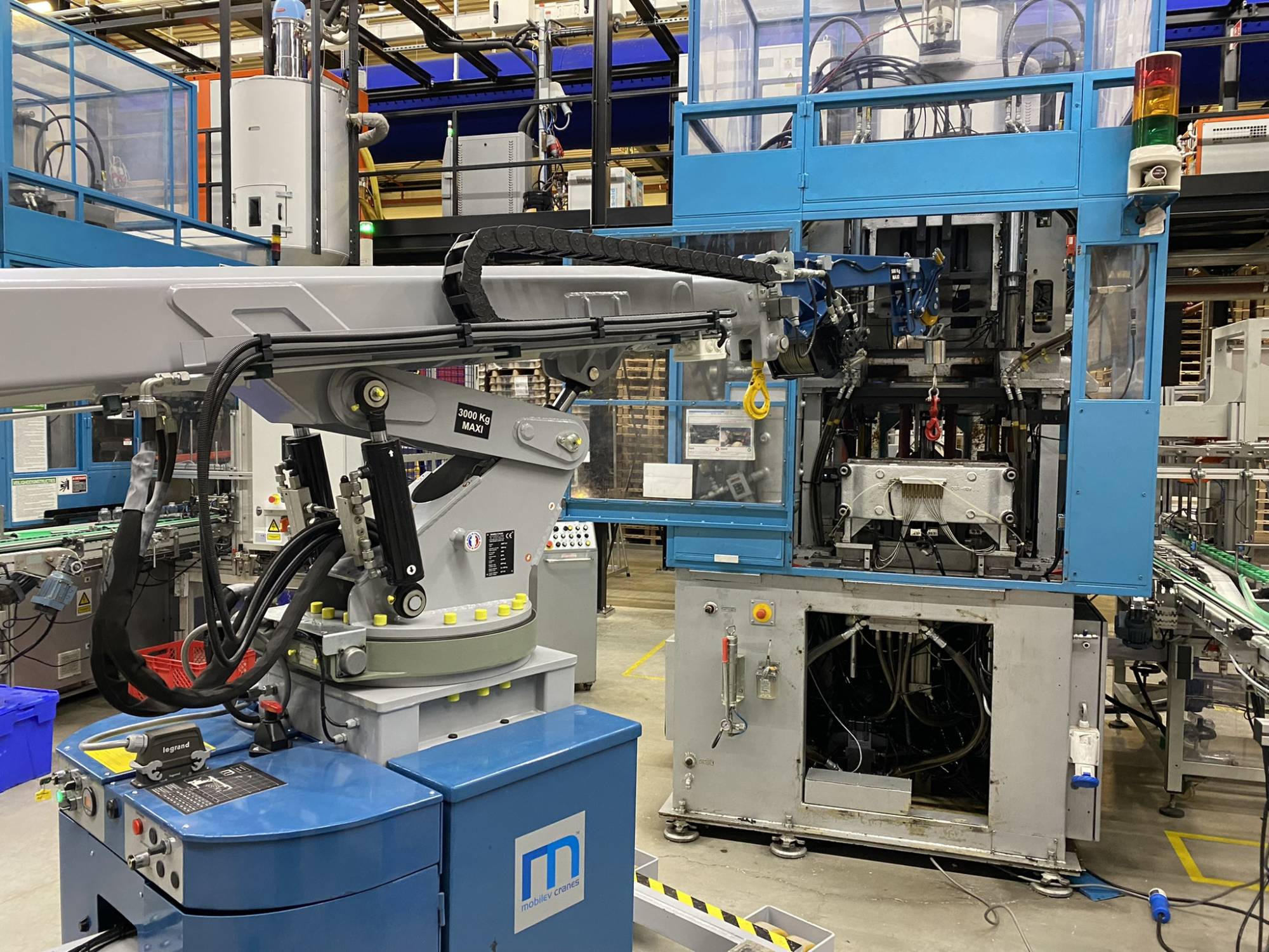 grue pour les presses à injecter